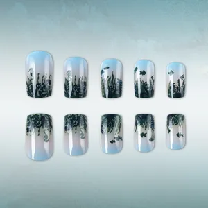 Short square press-on nails with blue-green sea grass gradient and ocean silhouettes