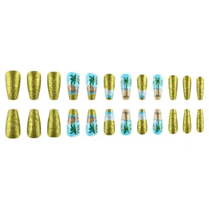 Y2K style gold glitter and blue press-on nails with tropical coconut tree beach patterns