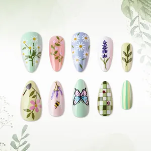 Green almond false nails with floral and butterfly patterns for spring and summer