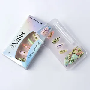Detail of almond-shaped press-on nails with green floral, bee and lavender designs