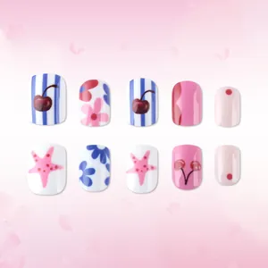 Short square press-on nails with pink flowers, blue cherry stripes, and star patterns