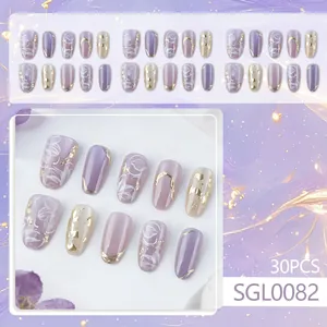 Dreamy purple almond press-on nails set with gold foil and hand-painted floral accents
