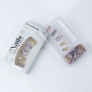 Macro detail of almond press-on nails featuring purple gradient and gold foil accents