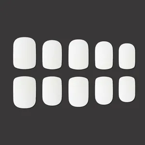 Matte white professional press-on nail adhesive tabs in 10-piece tiered size set