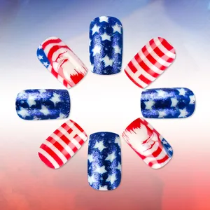 Macro view of Independence Day short fake nails with glitter star patterns and Santa Claus