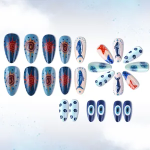Detailed macro view of almond ocean style press-on nails with starfish and evil eye patterns