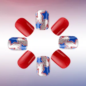 Detail of short square press-on nails with red gloss and silver star pattern