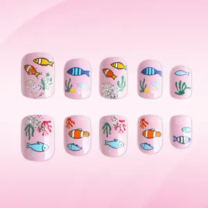 Pink glitter press-on nails with marine sea life art featuring tropical fish and coral