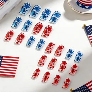 Macro detail of glossy red and blue glitter star press-on nails with American flag design