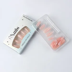 Detail of pink glitter press-on nails set in white retail packaging with inner tray