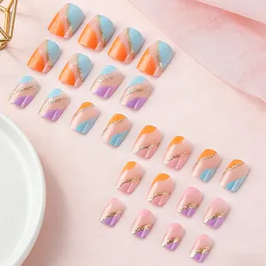 Detail of short almond macaron press-on nails with glitter waves and colorful stripes