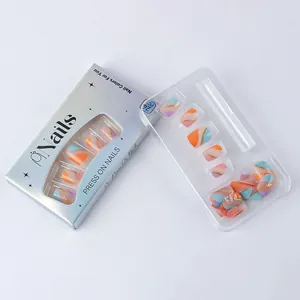 Detail of short press-on nails with colorful wave patterns and sparkling glitter lines