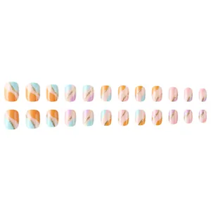Short round macaron press-on nails with glitter wave patterns and mixed color blocks