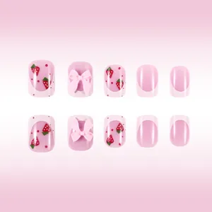 Short oval press-on nails with pink French tips, 3D bows and cute strawberry patterns
