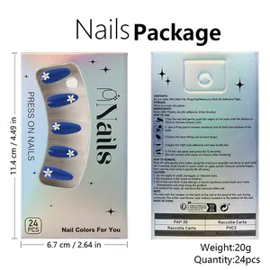 Detail view of glossy blue press-on nails set with white daisy design and tool kit