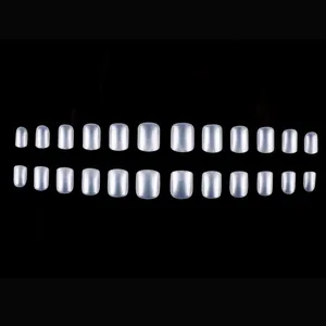 Macro shot of 24 pieces pearl white short square press on nails with glossy translucent finish