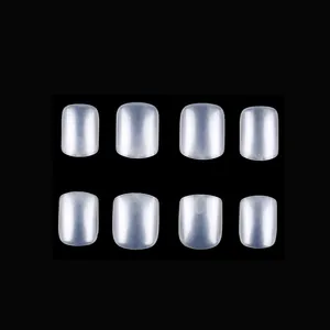 Detailed view of glossy translucent short square press-on nails on black background