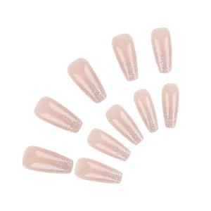 Medium coffin fake nails in nude pink with silver glitter gradient and glossy finish