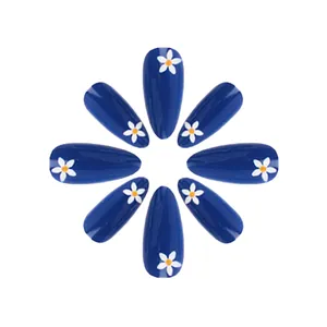 Short almond press-on nails with shiny dark blue finish and white daisy floral patterns