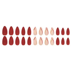 Set of 24 red and pink almond press-on nails with gold glitter and streamlined accents