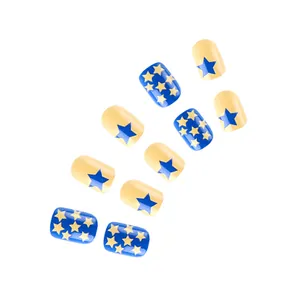 Detailed view of blue and yellow star pattern short square press-on nails set