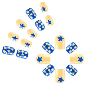 Short press-on nails with blue and yellow star contrast design on white background