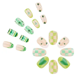 Green and white floral checkered press-on nails set with heart and stripe patterns