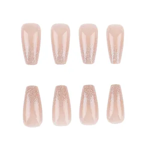 Detail of nude medium trapezoid press-on nails with silver glitter and fine line borders