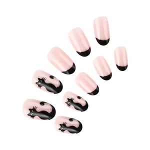 Detail view of 24pcs Halloween almond press-on nails with black cat and French tips art