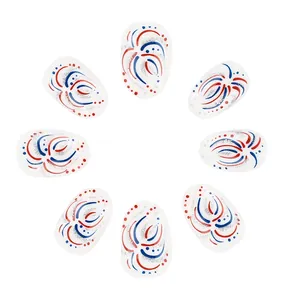 Macro view of Independence Day short oval press-on nails with red blue fireworks and silver glitter