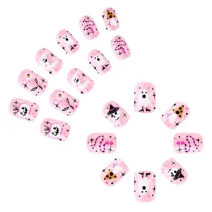 Pink Halloween press-on nails set featuring cute ghost, pumpkin, and skull patterns