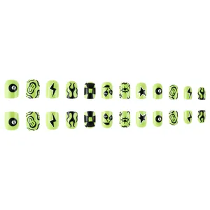 Short green Halloween press-on nails with punk black 8 ball and flame patterns