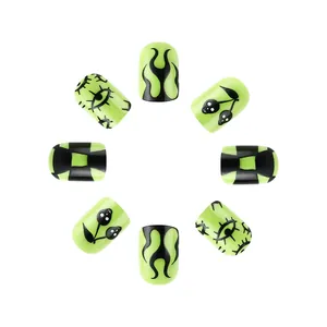 Short round neon green press-on nails with black flame and skull patterns for Halloween