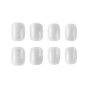 Macro shot of silver glitter press-on nails with shiny sandblast texture finish