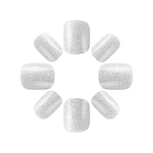 Detailed view of silver glitter short square press-on nails with shiny metallic finish