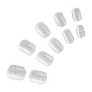 Macro view of 10-piece set of silver glitter frosted short press-on toenails