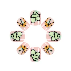 Pink French short fake nails set with green heart and yellow star geometric patterns
