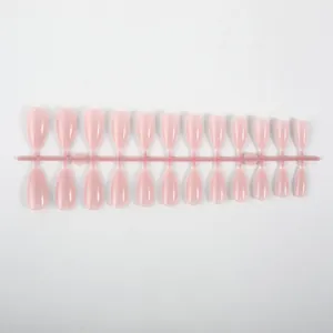Detailed view of 24pcs glossy pink almond fake nails arranged on a plastic strip