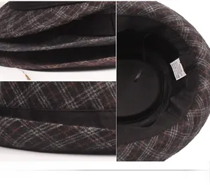 Détail macro d'une casquette gavroche à carreaux en laine avec étiquette interne