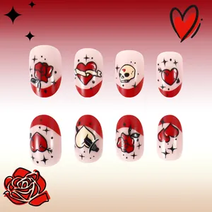 Detail of short press-on nails featuring vintage red roses and heart tattoo patterns