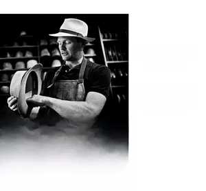 Artistic close-up of a classic felt fedora hat showcasing premium quality and craftsmanship