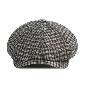 Classic houndstooth newsboy cap in brown and beige tweed fabric with top button