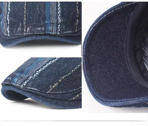 Detailed close-up of striped denim fabric and reinforced stitching on beret cap