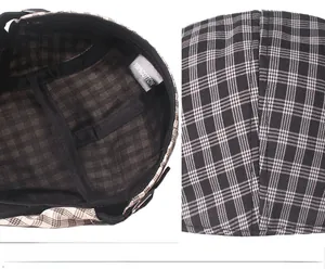 Detail of vintage plaid beret showing 100% cotton lining and classic checkered fabric