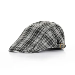 Detail shot of the vintage plaid ivy cap featuring an adjustable bronze metal buckle back