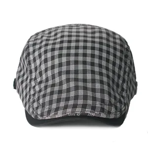 Classic black and grey plaid newsboy cap with structured short brim for men and women
