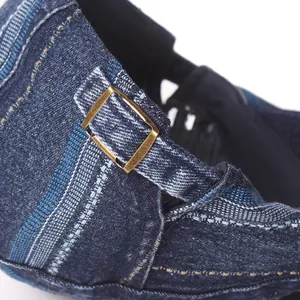Vintage washed denim beret featuring classic blue stripes and bronze metal buckle detail