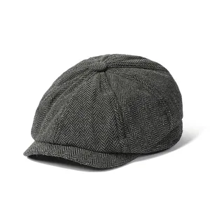Classic dark grey herringbone newsboy cap for men with a vintage wool texture style