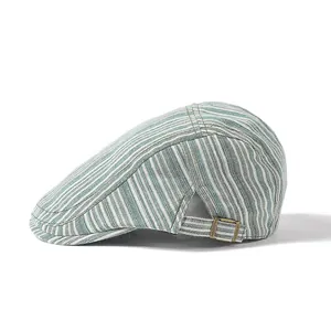 Detail of light green striped beret cap showing breathable fabric and metal buckle