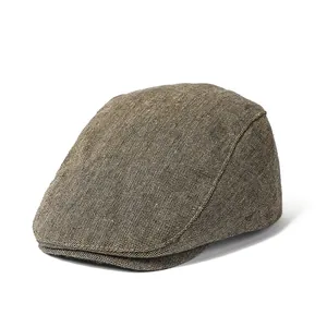 Classic men's brown tweed beret cap with retro British herringbone twill texture
